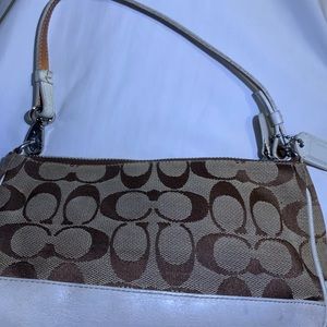 Women’s coach small purse just might need some cleaning